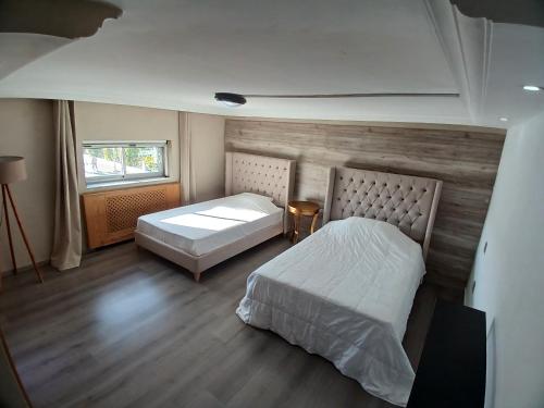 Postel nebo postele na pokoji v ubytování Loft inn les berges du lac 1