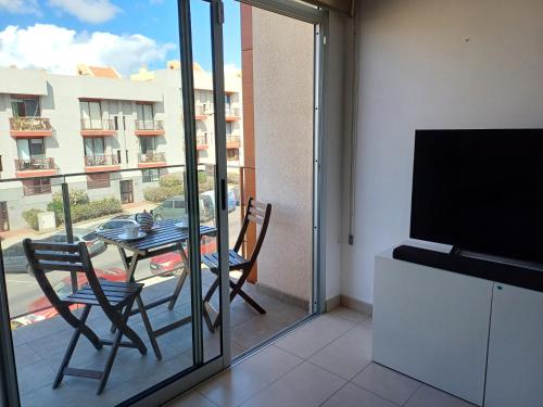 TV a/nebo společenská místnost v ubytování VESPUCIO SALINETAS, tu escapada a la playa