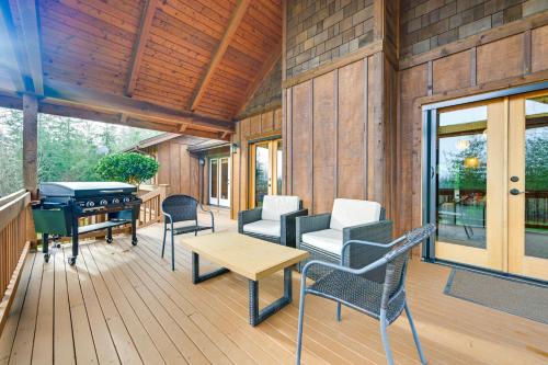 a screened porch with furniture and a pool table at Gorgeous Home with Mt Rainier Views 4 Mi to Poulsbo in Poulsbo
