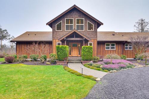 a large house with a yard with a driveway at Gorgeous Home with Mt Rainier Views 4 Mi to Poulsbo in Poulsbo