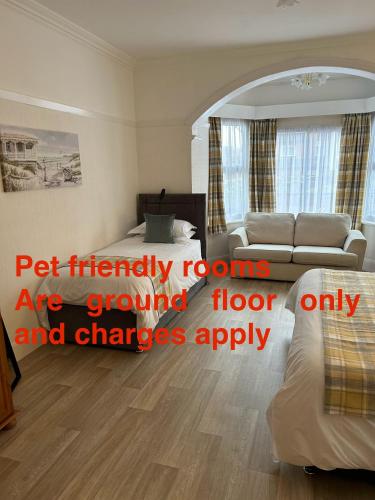a bedroom with a bed and a living room at Knighton Lodge in Skegness