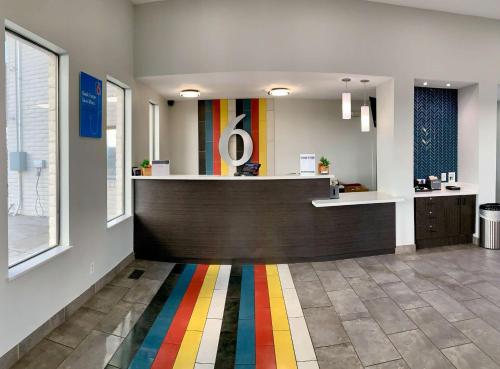 a lobby with a colorful rug on the floor at Motel 6-Ogden, UT - 21st Street in Ogden