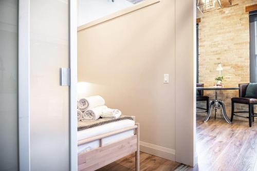 a room with a sliding glass door with a table at MR Loft formerly The Lehman Studio Stratford in Stratford