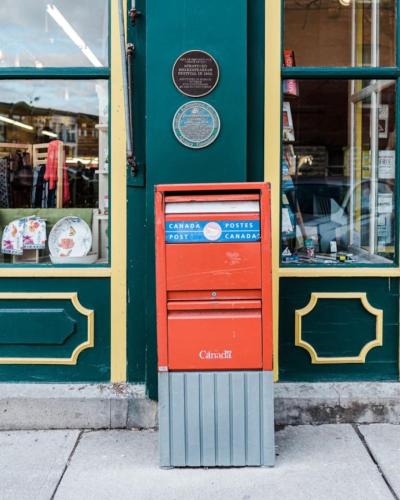 a mail box sitting in front of a store at The Wallace Suite - Stratford in Stratford