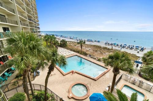 an overhead view of a pool and the beach at Commodore 410 in Panama City Beach