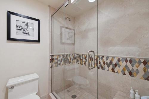 a bathroom with a glass shower with a toilet at The Charter at Beaver Creek C115 in Beaver Creek