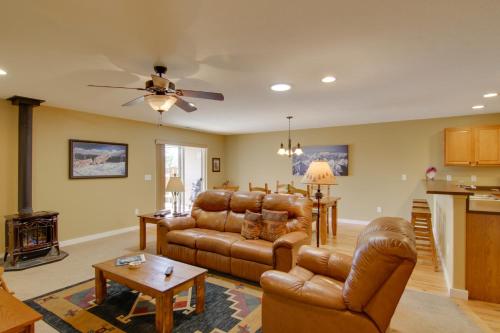 a living room with a couch and a table at Bozeman Condo with Grill about 2 Mi to Hot Springs! in Bozeman
