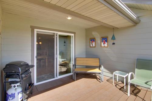 a screened in porch with a bench and a chair at Bozeman Condo with Grill about 2 Mi to Hot Springs! in Bozeman