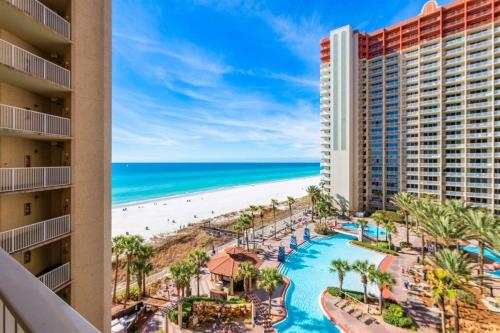 a view of the beach from the balcony of a resort at Shores of Panama 727 - Same level parking space! in Panama City Beach