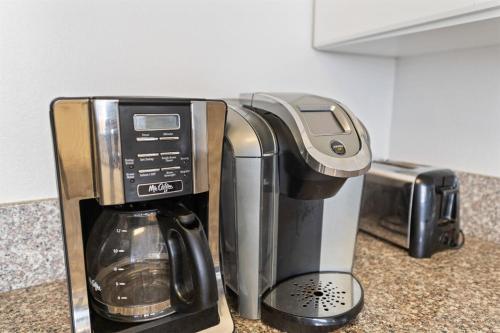 a coffee maker sitting on top of a counter at Shores of Panama 727 - Same level parking space! in Panama City Beach