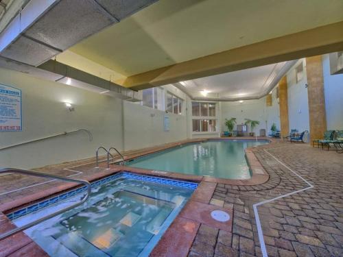 a large swimming pool in a building at Shores of Panama 1307, Two Masters! Under 25 ok! in Panama City Beach