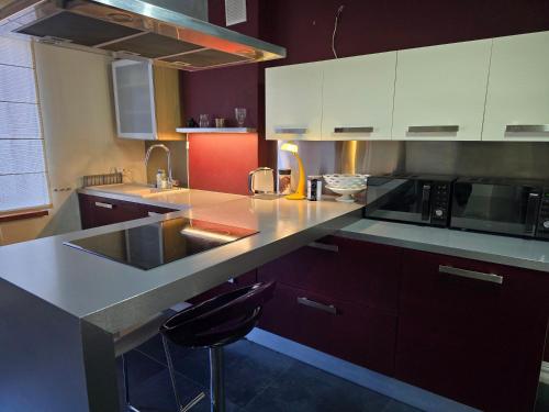 a kitchen with a sink and a counter top at Pokoje gościnne na terenie Chojnowskiego Parku Krajobrazowego in Ławki