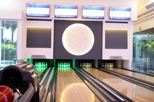 a bowling alley with a ball and bowling lanes at Dreams Onyx Resort & Spa - All Inclusive in Punta Cana