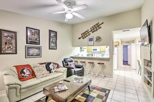 a living room with a couch and a table at Tallahassee Townhome 4 Mi to College Town! in Tallahassee