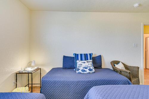 a bedroom with two beds with blue pillows at Walk to Gulf Surfside Beach Home with Deck in Surfside Beach