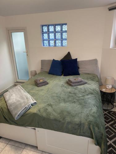 a bedroom with a large bed with two pillows on it at Subterranean idyll in the House of Peace in Timişoara