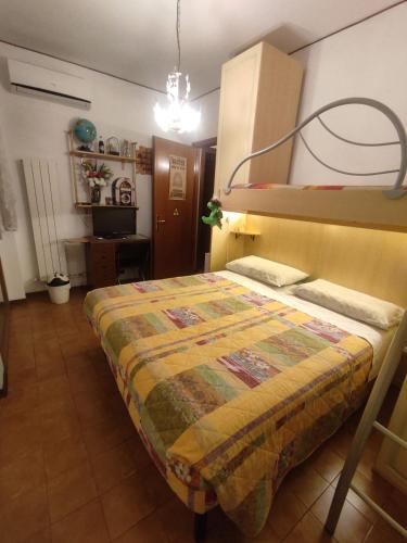 a bedroom with a bed and a bunk bed at La Jolie in Pisa