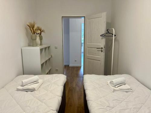 Postel nebo postele na pokoji v ubytování Wohlfühl-Apartment mit gemütlichem Balkon