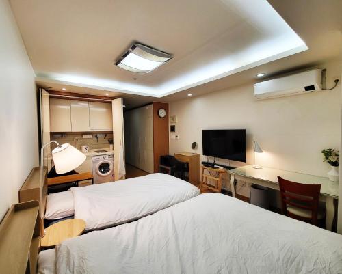 Postel nebo postele na pokoji v ubytování Khan Residence
