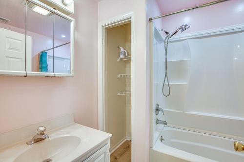 a white bathroom with a shower and a sink at Beach House with Private Pool in North Wildwood in North Wildwood