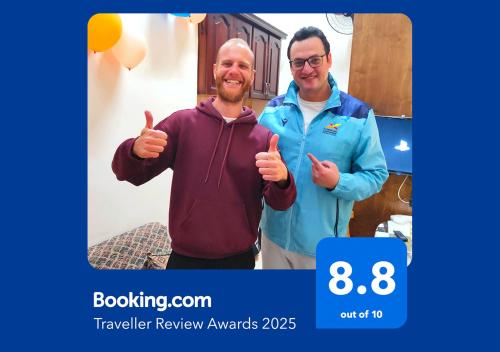two men giving the thumbs up in a picture at Youth Palace Hostel هوستل قصر الشباب in Alexandria