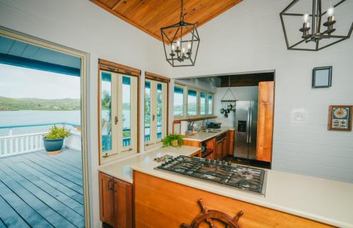a kitchen with a view of the water at AMAZING Bay View Marea 2-2 in Culebra