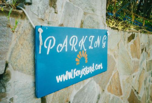 a blue sign on a stone wall at AMAZING Bay View Marea 2-2 in Culebra