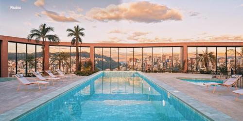 Πισίνα στο ή κοντά στο Hermoso Departamento con Piscina en Edificio EPIQ