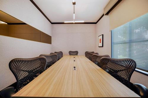 a conference room with a long table and chairs at Homewood Suites by Hilton Plano-Richardson in Plano