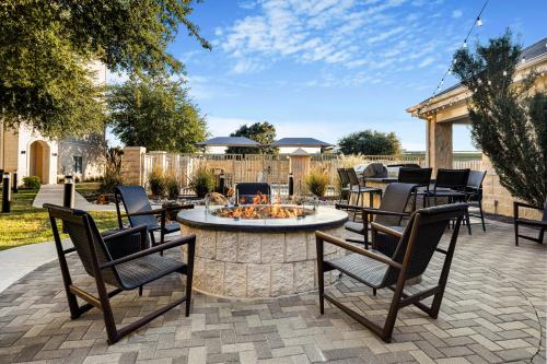 a patio with chairs and a fire pit at Homewood Suites by Hilton Plano-Richardson in Plano