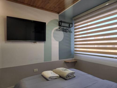 Ένα ή περισσότερα κρεβάτια σε δωμάτιο στο Conexión apartamentos y habitaciones