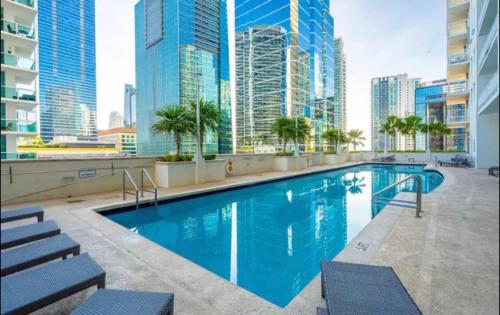 a swimming pool on the roof of a building with tall buildings at Centric 40thFloor Brickell Condo FREE parking by Palermo Home Miami in Miami