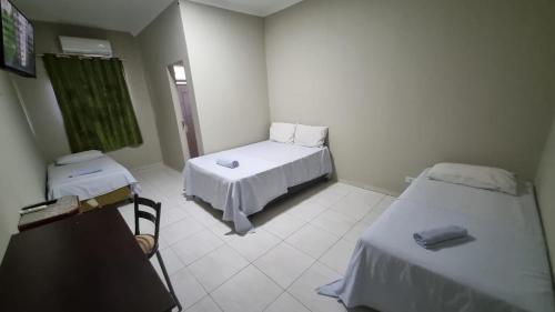 Ένα ή περισσότερα κρεβάτια σε δωμάτιο στο Hotel do Vale