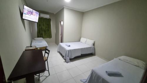 Ένα ή περισσότερα κρεβάτια σε δωμάτιο στο Hotel do Vale