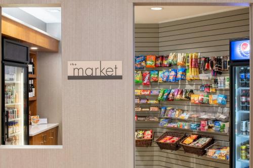 a grocery store aisle with a display of food at SpringHill Suites Portland Airport in Portland