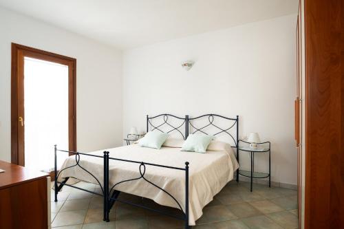 Postel nebo postele na pokoji v ubytování Villetta Bouganville