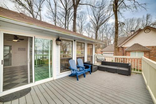 a porch with two chairs and a couch on it at Home on Lake Fork Patio, Grill and Fire Pit! in Yantis