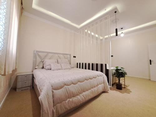 Ένα ή περισσότερα κρεβάτια σε δωμάτιο στο Cozy Home