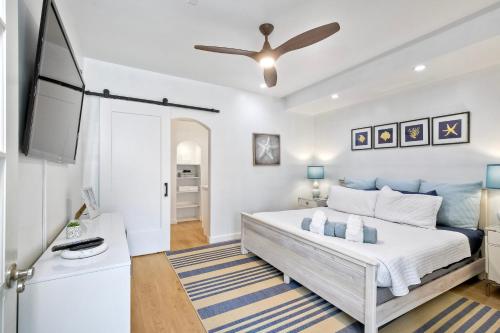 a bedroom with a bed and a flat screen tv at La Costa Escape - Pool, BBQ, Gated Parking in Encinitas