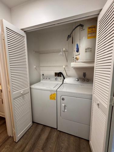 a small laundry room with two washes and a washer at Perfect lodging in Lake Placid in Lake Placid