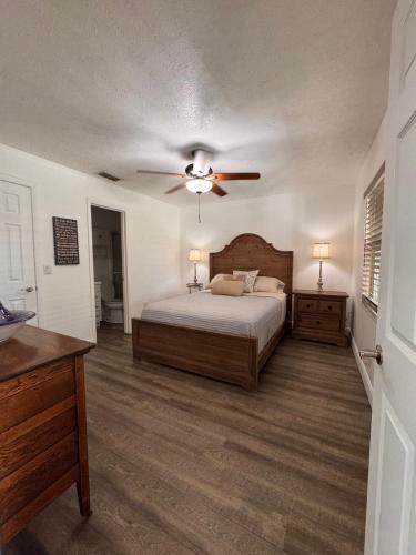 a bedroom with a bed and a ceiling fan at Perfect lodging in Lake Placid in Lake Placid