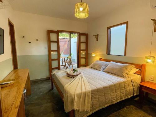 a bedroom with a large bed in a room at Recanto Alter do Chão in Alter do Chao