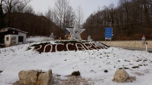 a statue of a star in the snow at Luna Reale Roccaraso apt in Roccaraso