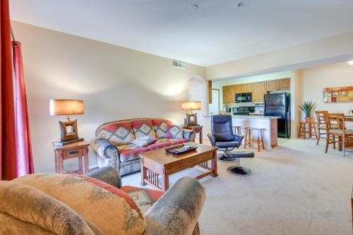a living room with a couch and a table at Pool Access, Private Patio and Grill Mesa Condo! in Mesa