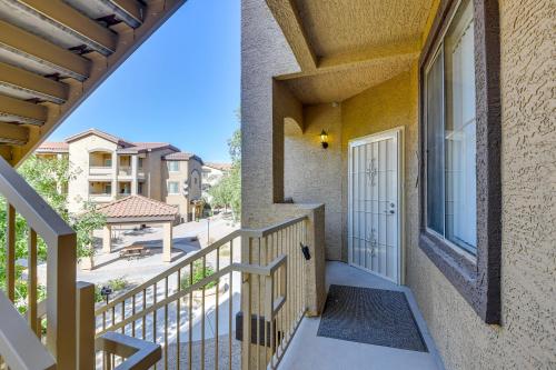 a balcony with a door and a view of a street at Pool Access, Private Patio and Grill Mesa Condo! in Mesa