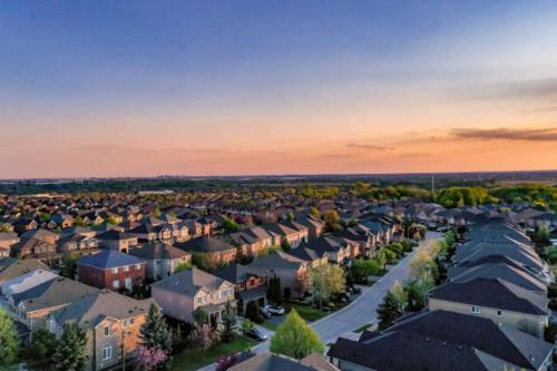 an aerial view of a residential suburb at sunset at Havenly Homes DMV in Arlington