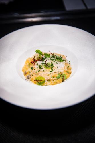 a white plate with a dish of food on a table at Hotel Wailea, Relais & Châteaux - Adults Only in Wailea
