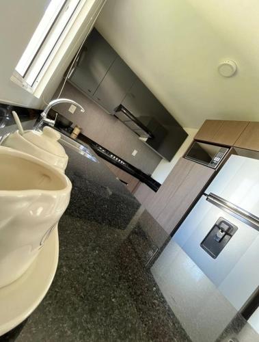 a bathroom with a sink and a toilet at La casa de Adiss in Mexico City