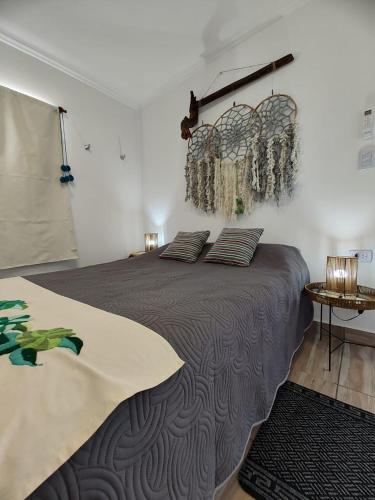 a bedroom with a large bed with pillows on it at Malaica in Tafí del Valle