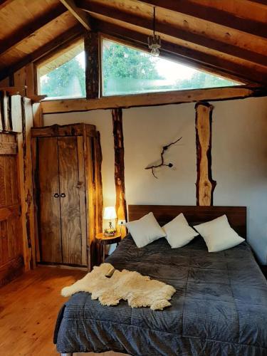 Katil atau katil-katil dalam bilik di Cabaña en Puerto Aysén